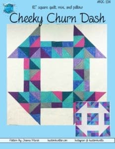 A quilt that is made of different colored squares.