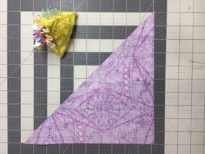 A piece of fabric is folded up on the floor.