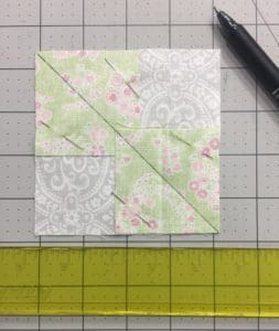 A piece of paper with a green and white pattern on it.