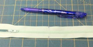 A pen and paper on top of a table.