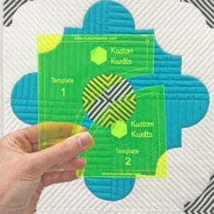 A person holding up two different sized squares.