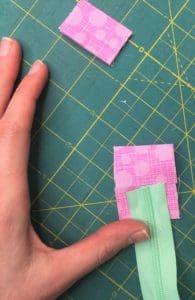 A person is cutting paper on the table