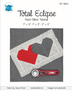 A black and white picture of a heart quilt.