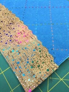 A close up of the fabric on a quilt