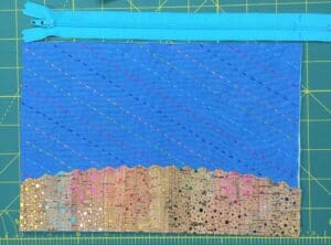 A blue bag with some sequins on it