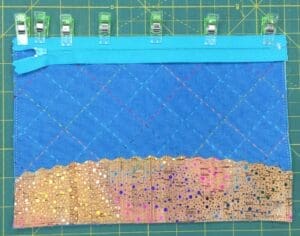 A close up of the fabric on a sewing machine