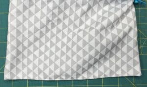 A close up of the fabric with triangles on it