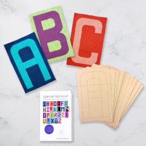 A table with several different colored letters and cards.