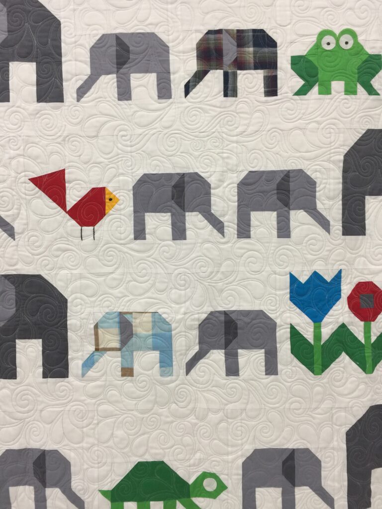 elephant quilt with feathered swirls