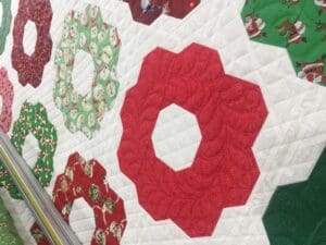 A close up of the red and green quilt