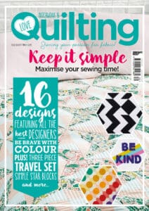 A magazine cover with a quilt on it.