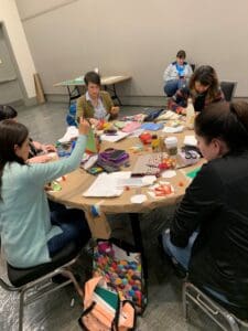 A group of people sitting around a table.