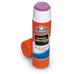 A tube of elmer 's liquid glue sticks next to an empty container.