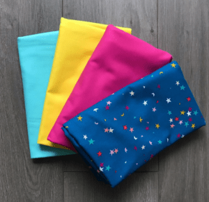 A group of folded fabric sitting on top of each other.