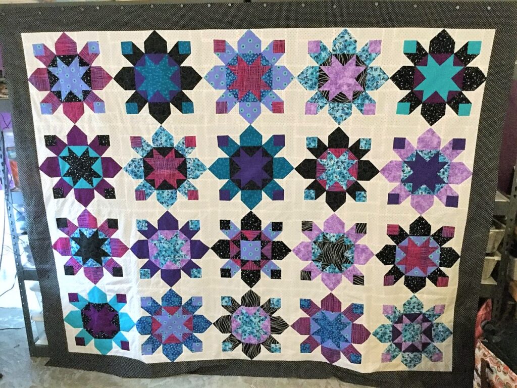 purple and white quilt