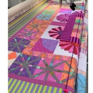 A quilt being worked on the machine