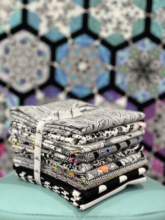hand holding fabric bundle in black and white