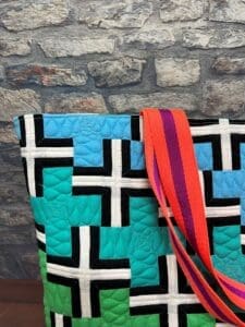 A close up of the shoulder strap on a bag