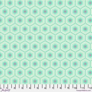 A green and pink pattern is on the ground.