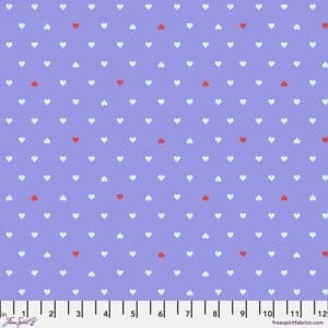A purple background with white and red polka dots.