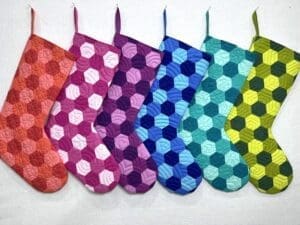 A row of colorful oven mitts in different colors.