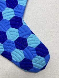 A close up of the blue and white pattern on a tie