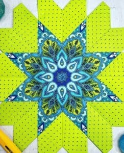 A close up of the center star on a quilt