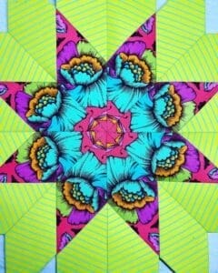 A colorful star quilt with bright colors and designs.