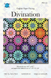 A colorful quilt with the word divination written underneath it.