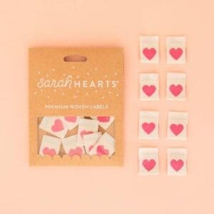 A package of pink hearts on top of a table.