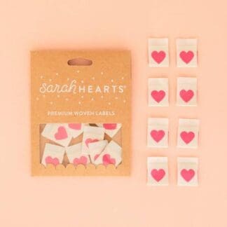 A package of pink hearts on top of a table.
