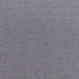 A gray fabric background with some white lines.