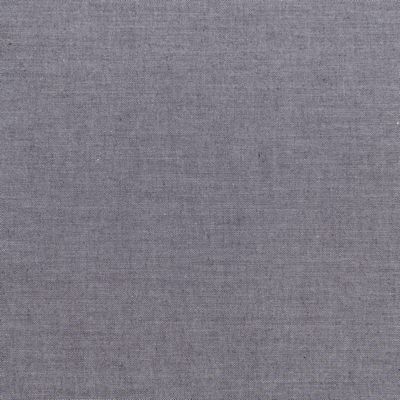 A gray fabric background with some white lines.