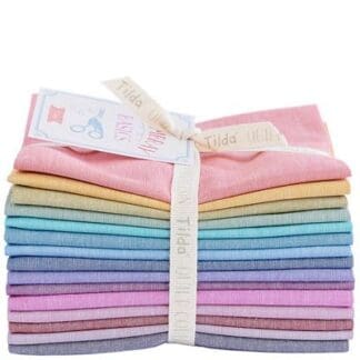 A bundle of pastel colored fabric folded into bundles.