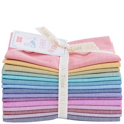A bundle of pastel colored fabric folded into bundles.