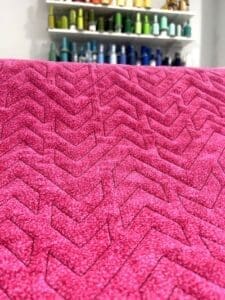 quilted out design of cupids arrow
