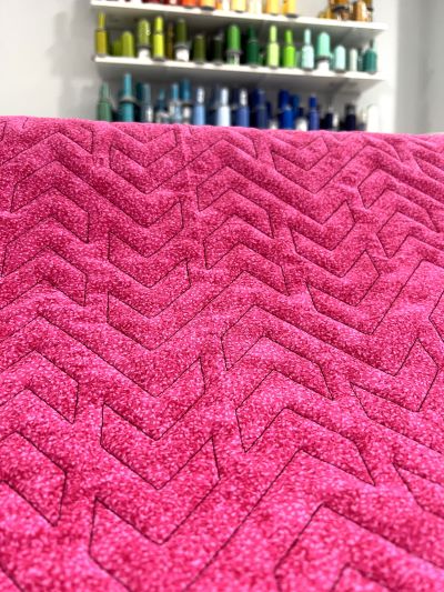 quilted out design of cupids arrow