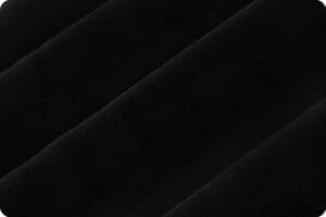 Close-up of soft black fabric with smooth texture.