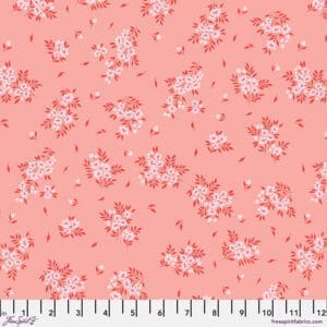 Pink fabric with small floral prints and white measuring tape.