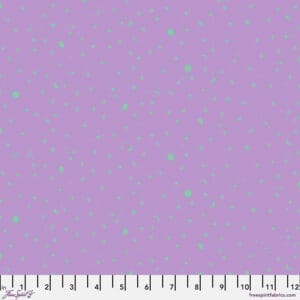 Purple fabric with small blue and green dots and a white ruler at the bottom.