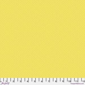 Solid yellow fabric swatch with ruler for scale.