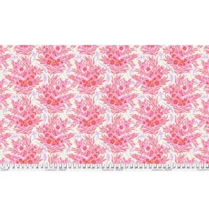 Pink floral damask pattern on white fabric with ruler for scale.