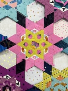 Colorful geometric pattern with hexagons and star shapes.