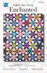 Colorful hexagonal floral quilt with intricate patterns.